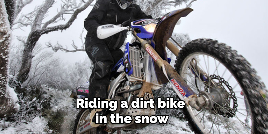 Riding a dirt bike in the snow