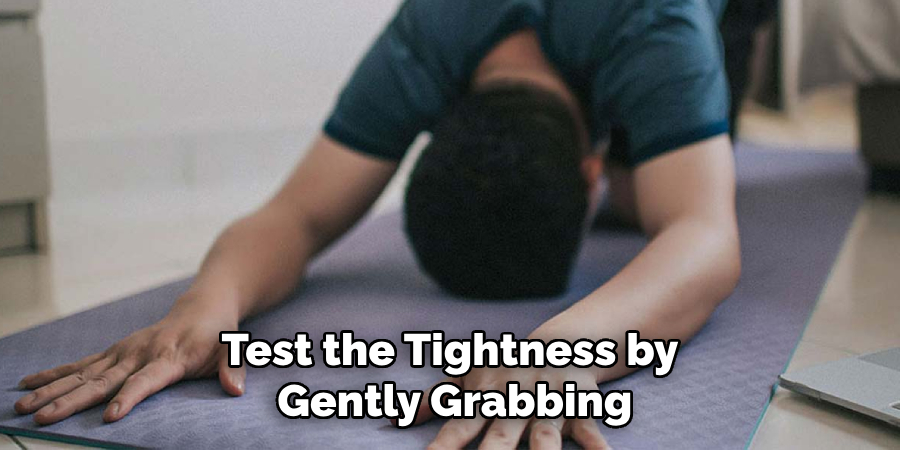 Test the Tightness by Gently Grabbing